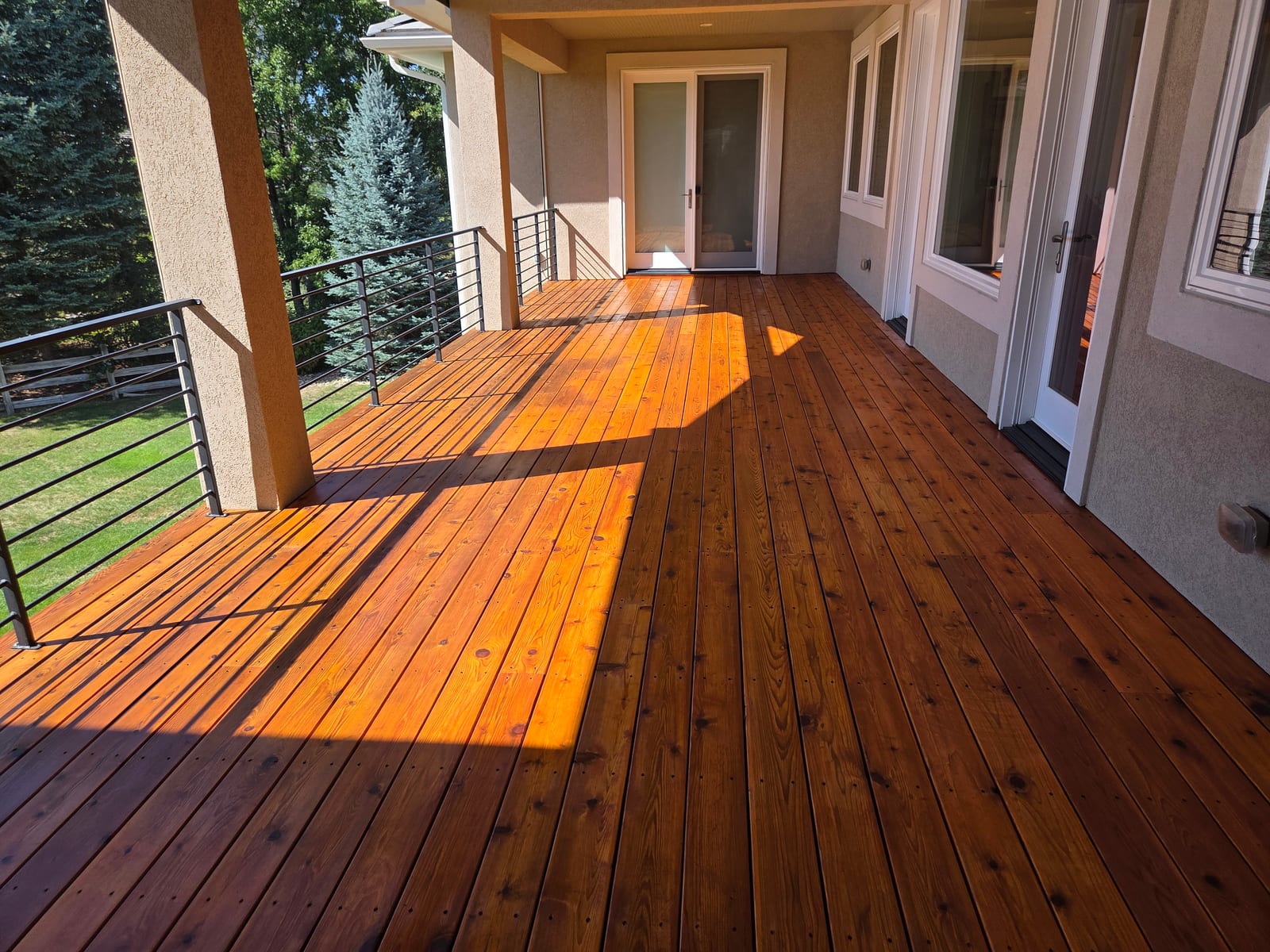 Finished covered deck stained in warm evening light